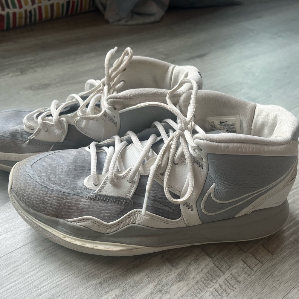 Nike Size 9.5 basketball shoes. Gray and white.